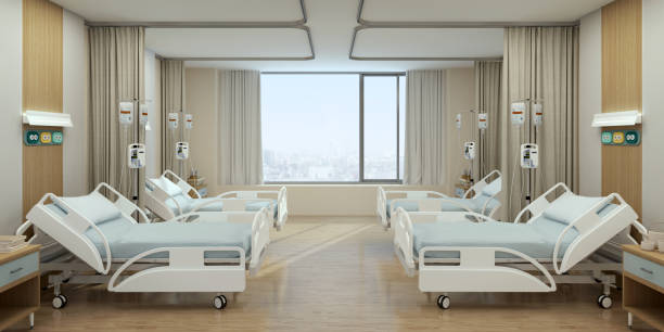 Hospital recovery room with beds and chairs