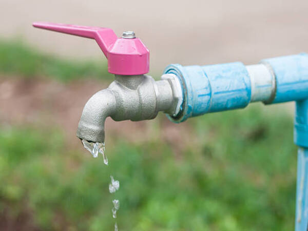Photo of water running down from faucet